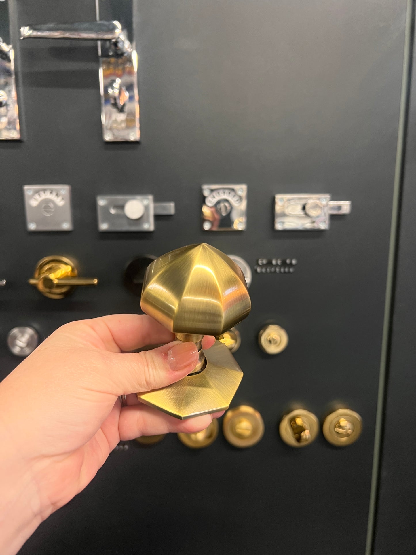 Antique brass faceted centre door knob