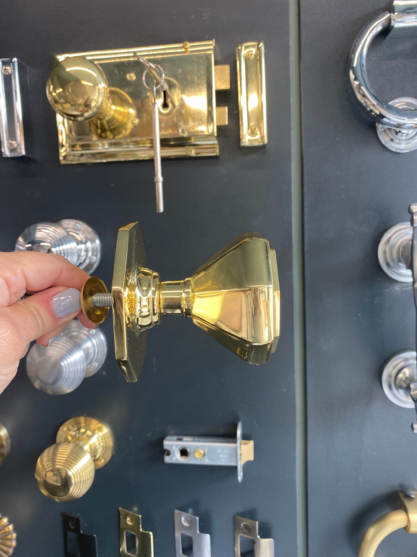 Flat octagonal centre door knob in Polished Brass