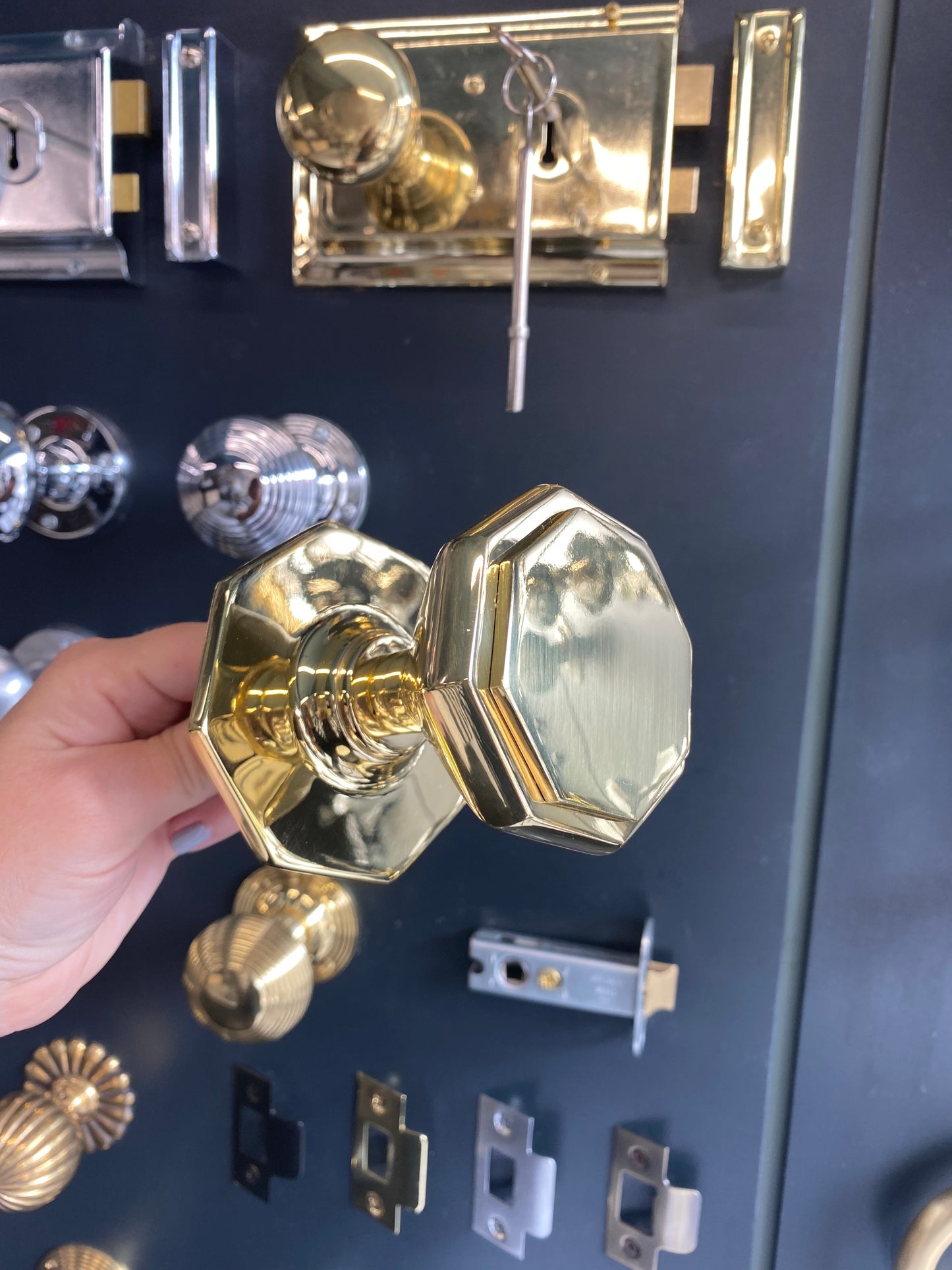 Flat octagonal centre door knob in Polished Brass