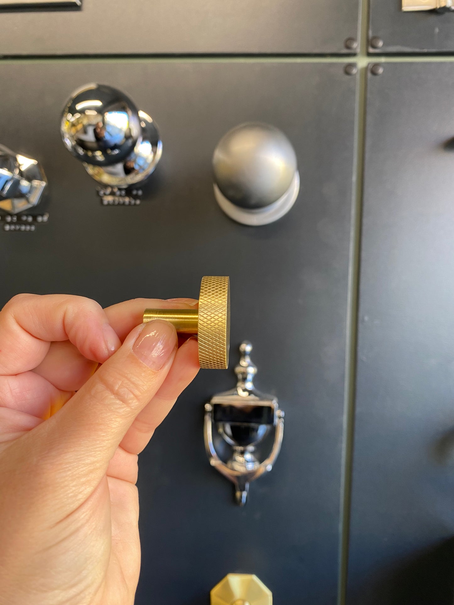 Round satin brass cupboard knob with knurled detail