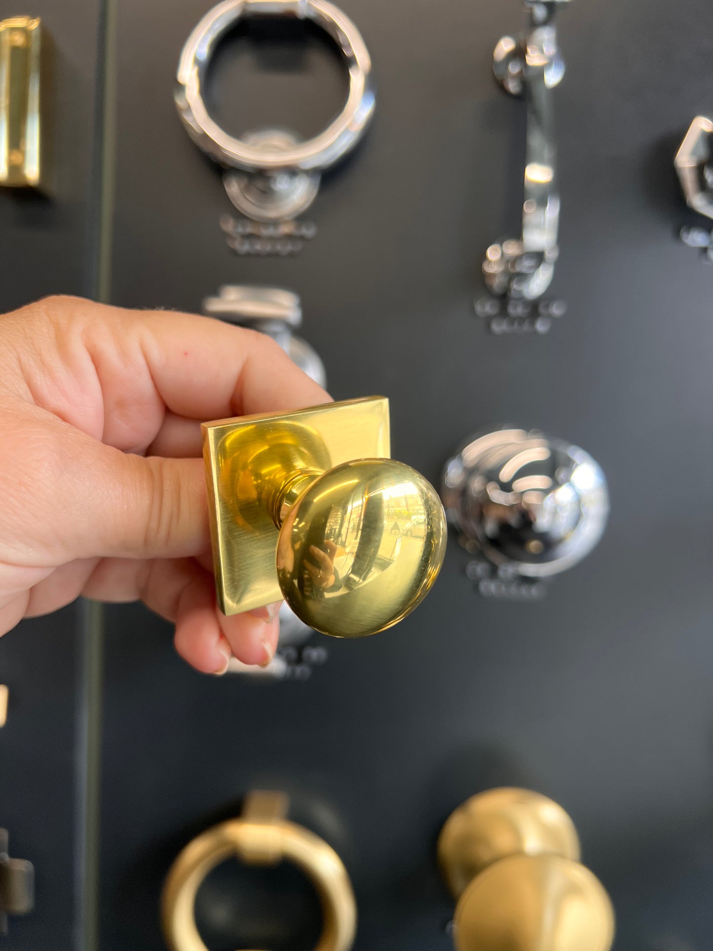 Victorian round cabinet knob with square backplate in polished brass