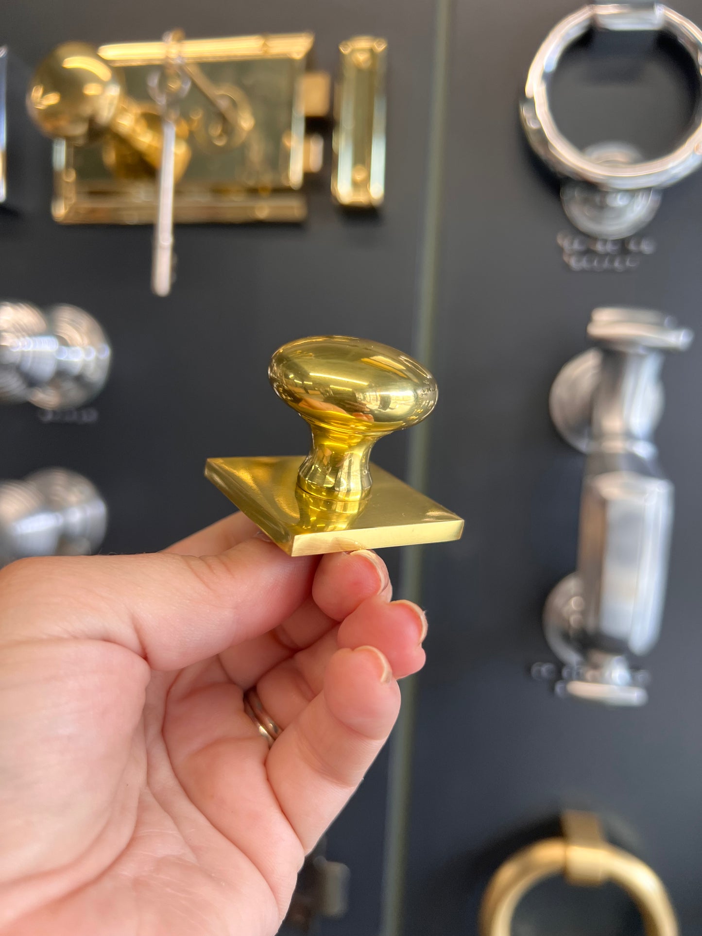 Victorian round cabinet knob with square backplate in polished brass