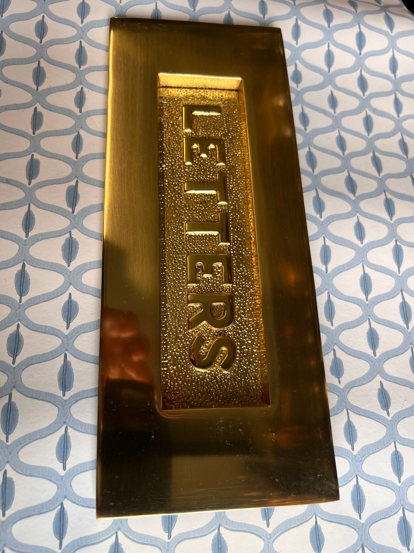 Polished brass letter plate tarnished