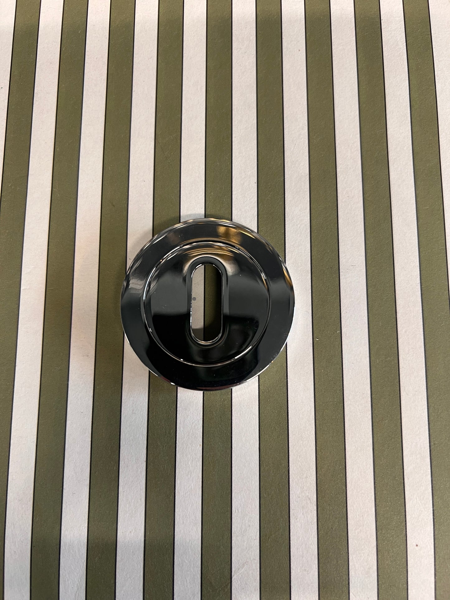 Round raised polished chrome escutcheon