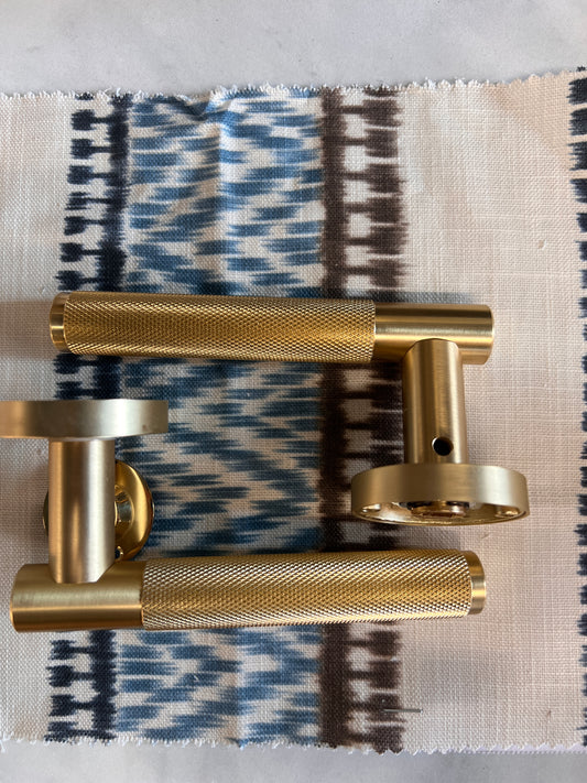 Satin brass knurled pair of lever handles