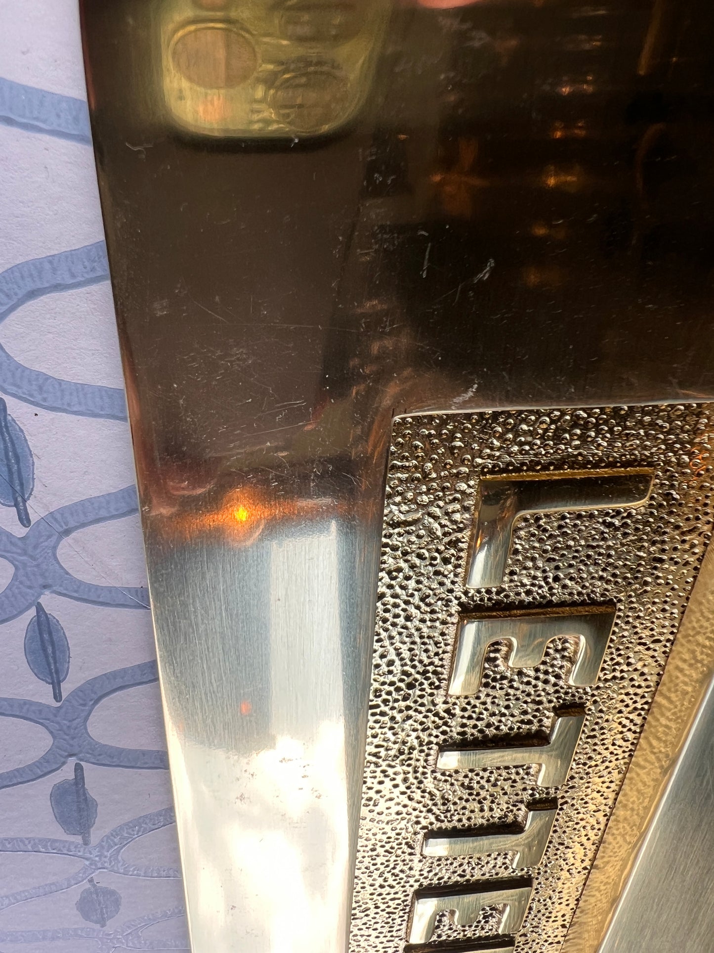 Polished brass letter plate tarnished