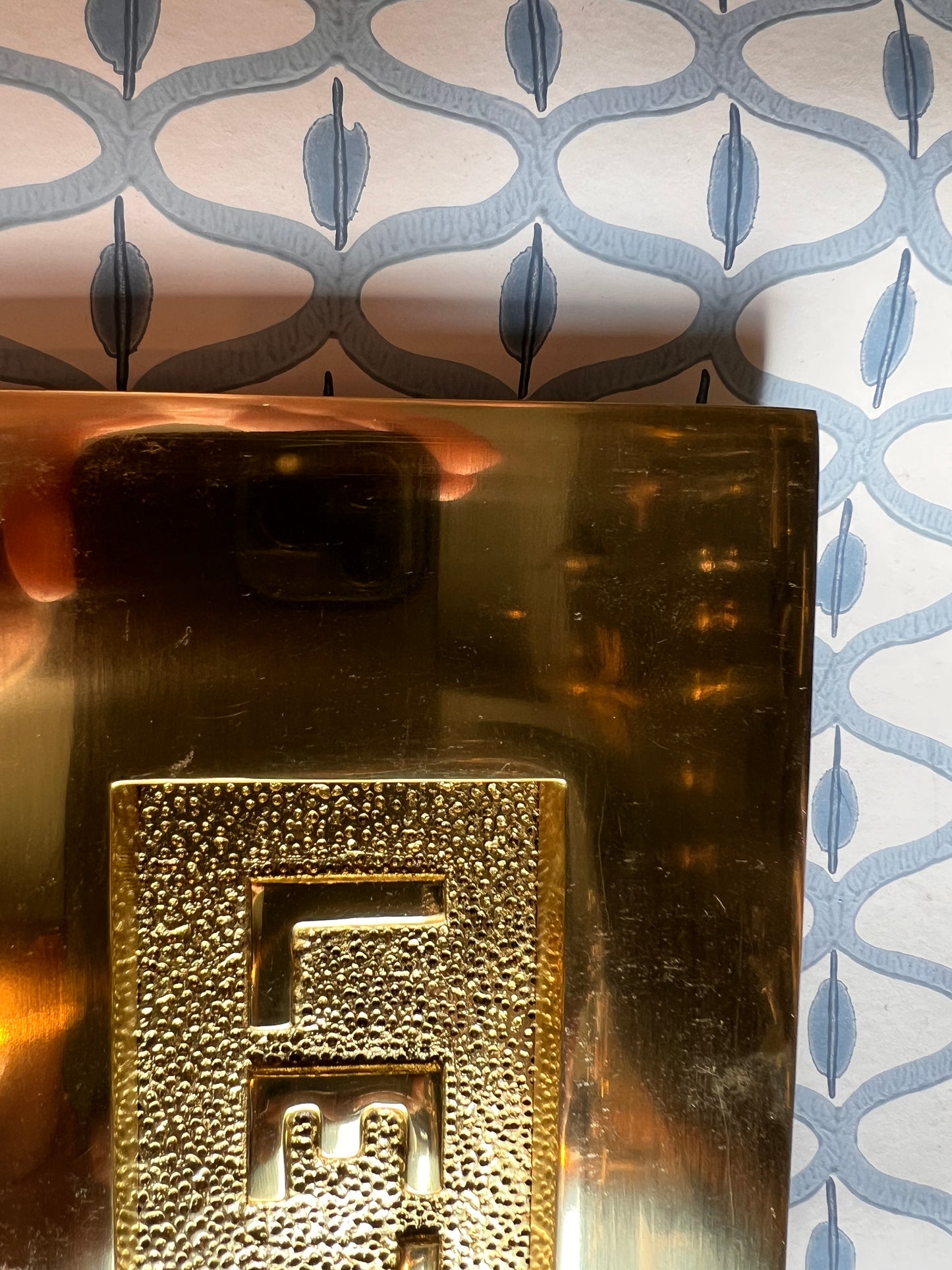 Polished brass letter plate tarnished