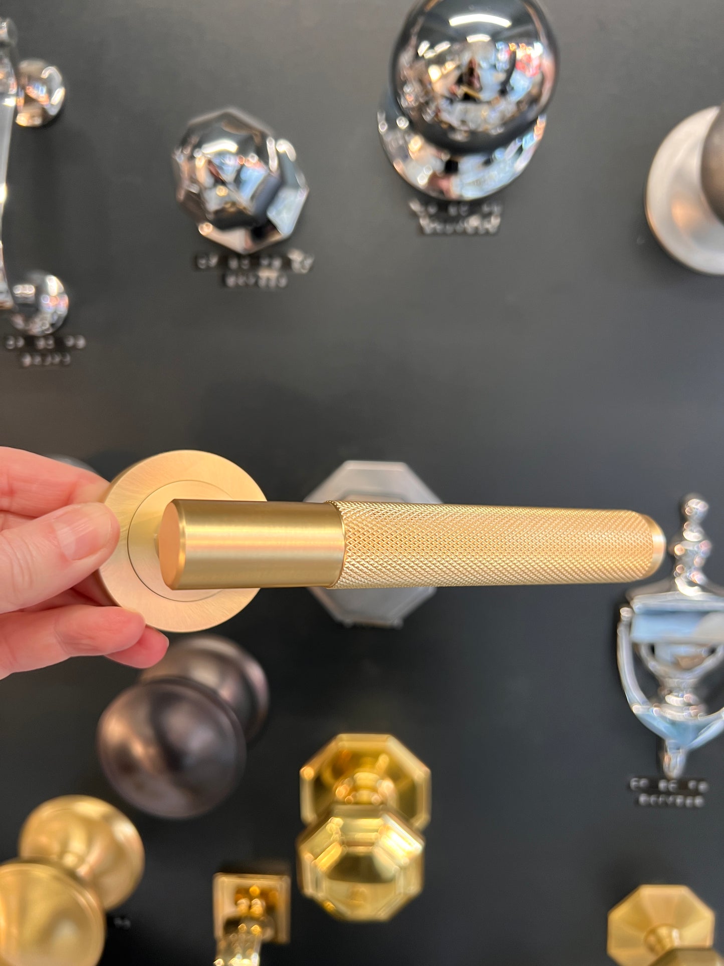 Satin brass knurled pair of lever handles