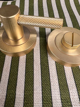 Load image into Gallery viewer, Bari knurled bathroom turn and release in satin brass