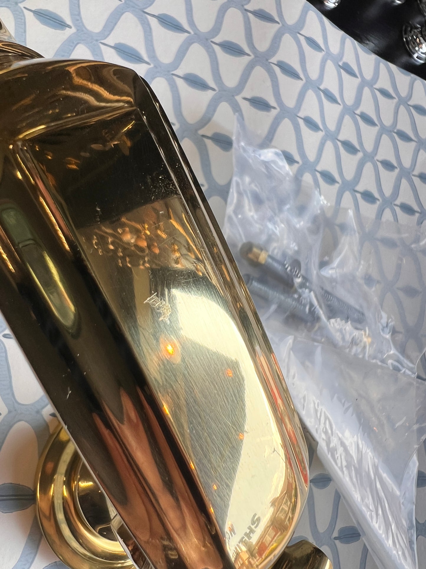 Polished brass heavy duty door knocker slight mark