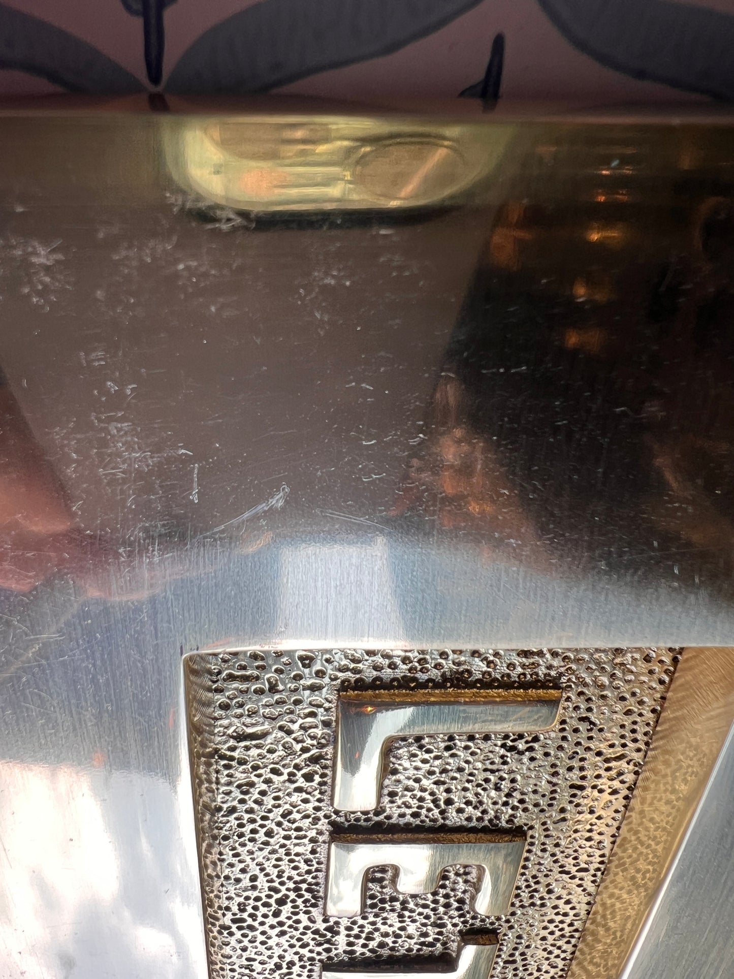 Polished brass letter plate tarnished