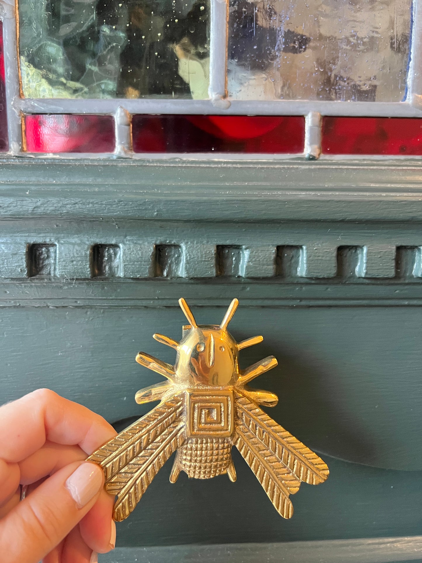 Brass beetle door knocker