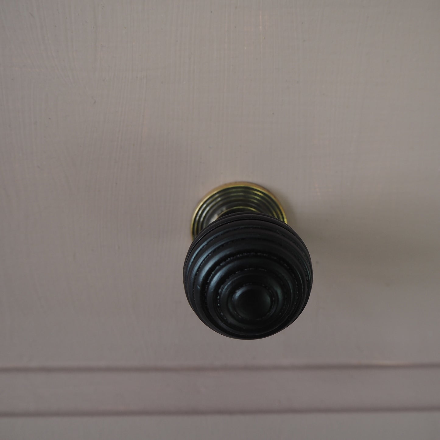 Ebony beehive cupboard knob with Aged brass rose