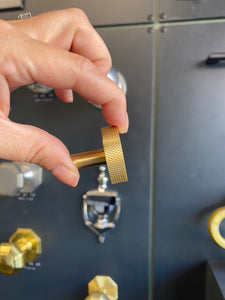Round satin brass cupboard knob with knurled detail