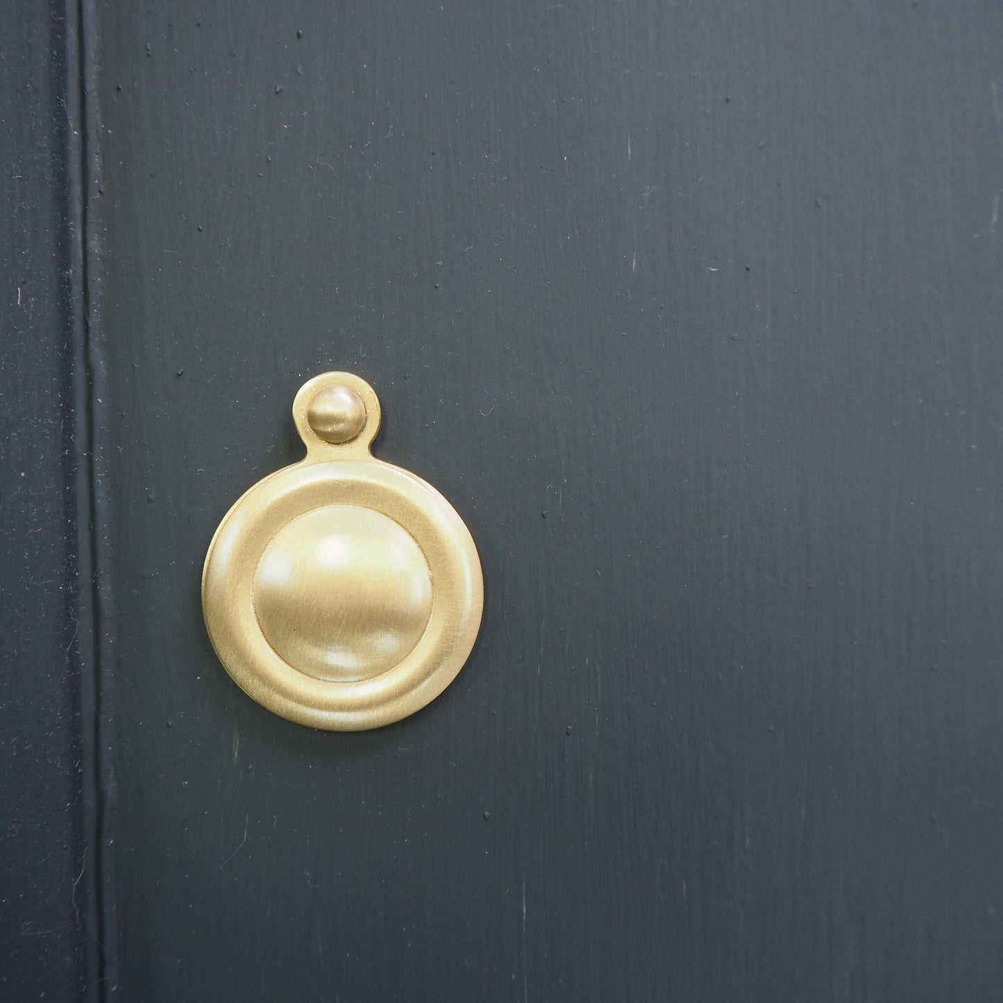 Satin brass covered round escutcheon