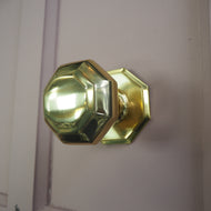 Octagonal polished brass centre door knob