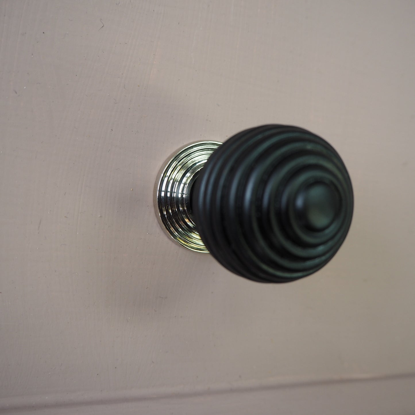 Ebony beehive cupboard knob with polished nickel rose