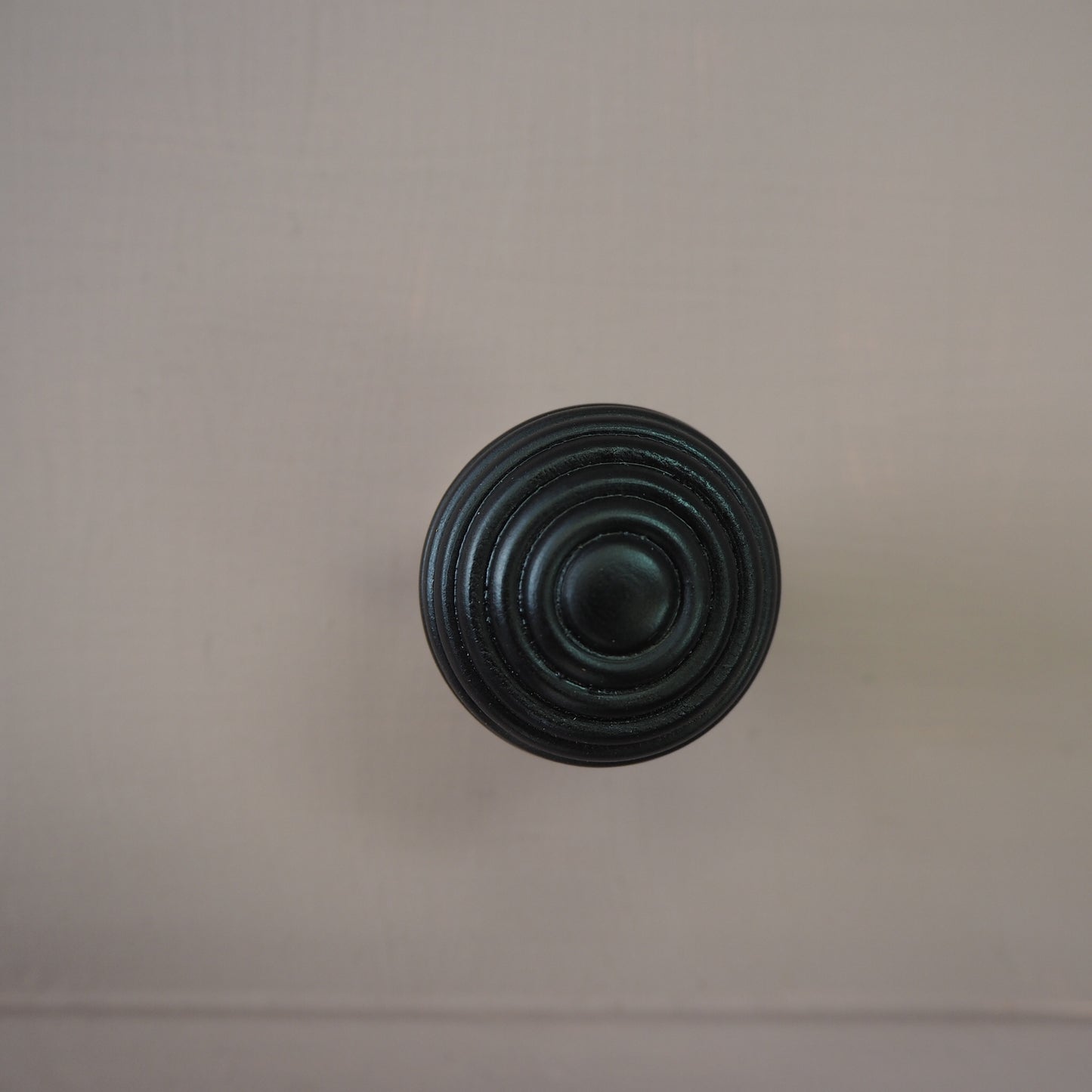 Ebony beehive cupboard knob with polished nickel rose