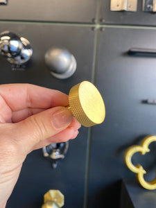 Round satin brass cupboard knob with knurled detail