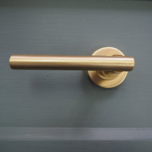 Load image into Gallery viewer, Challenger lever on rose handles satin brass