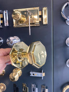 Flat octagonal centre door knob in Polished Brass