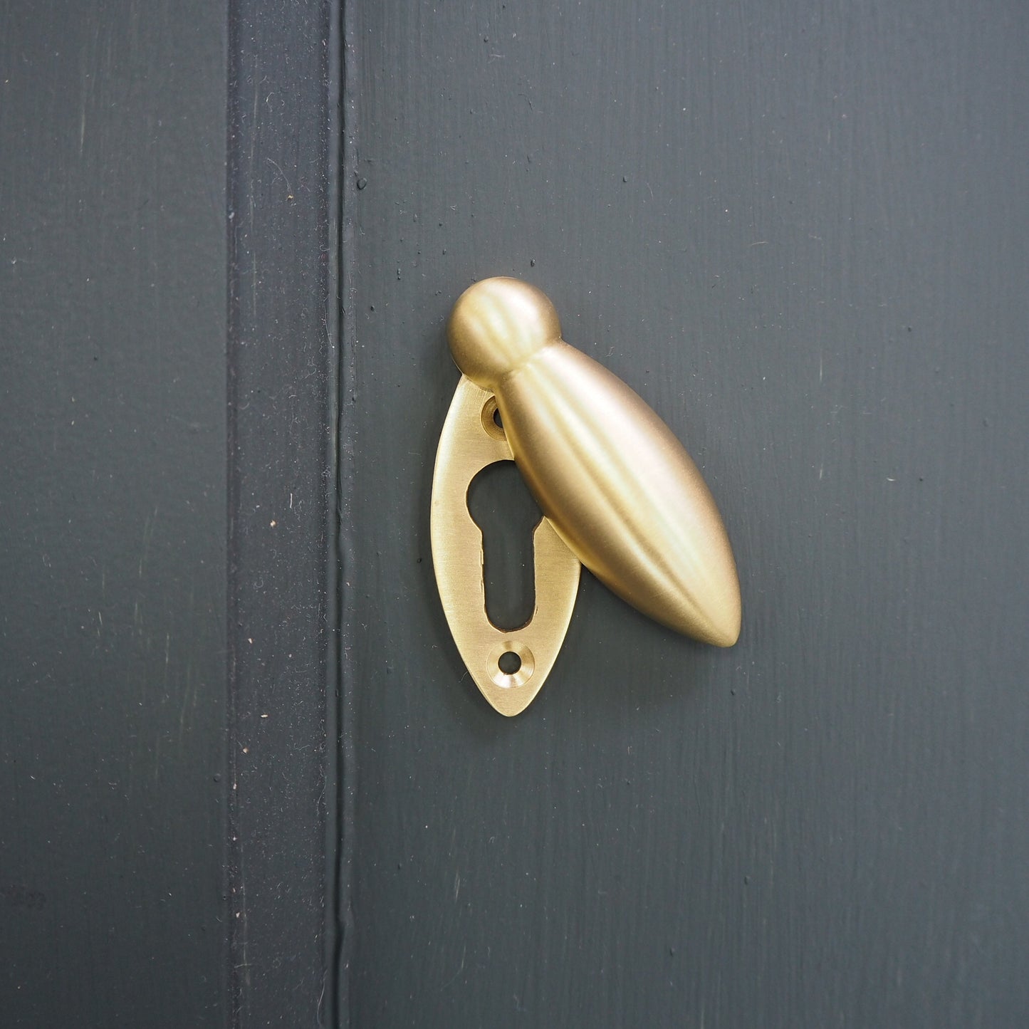 Satin brass tear drop escutcheon