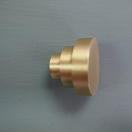 Round stepped satin brass cupboard knob