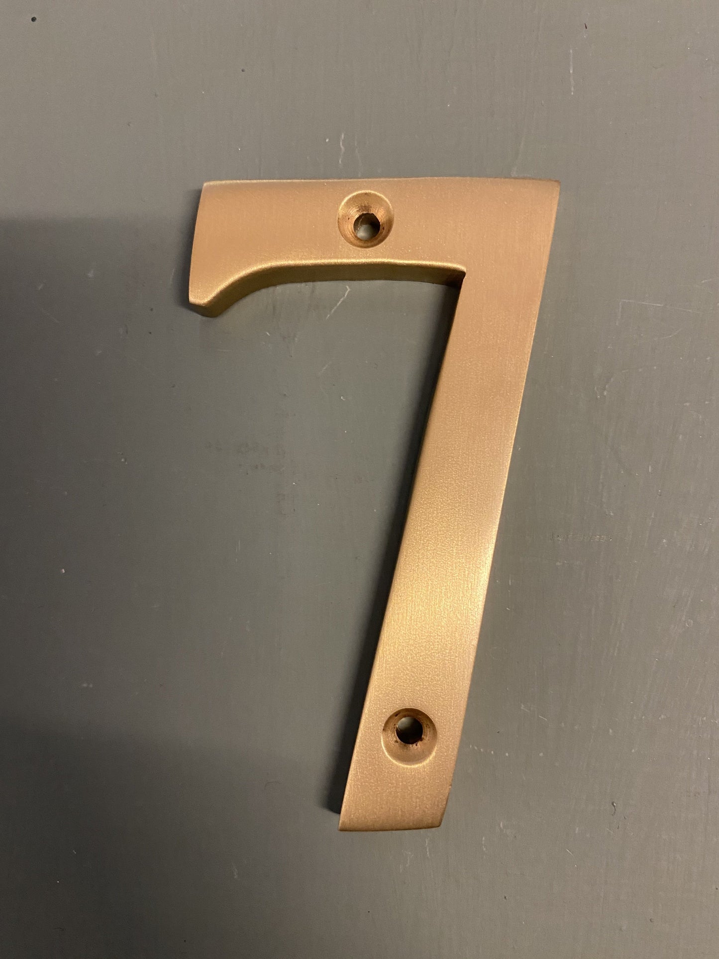 Satin brass numeral “7”