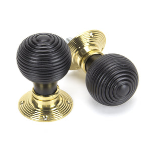 Black reeded mortice knob on brass backplate