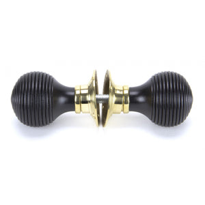 Black reeded mortice knob on brass backplate