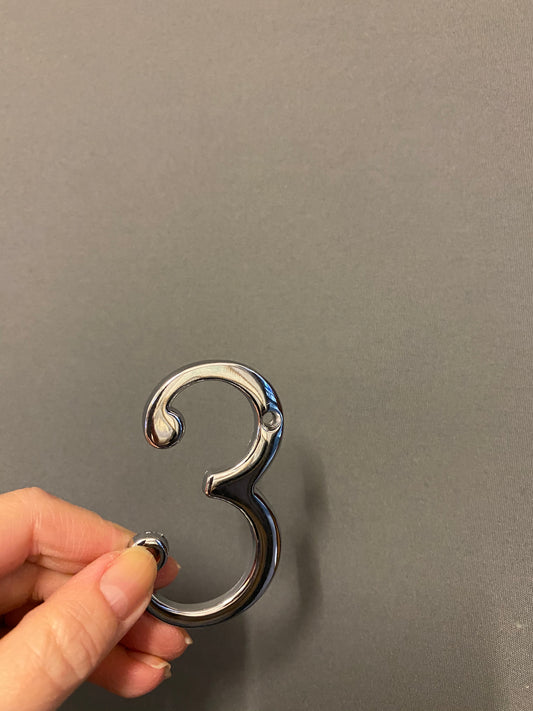 Polished chrome “3”