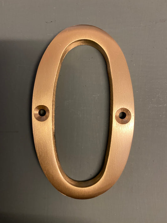 Satin brass numeral “0”