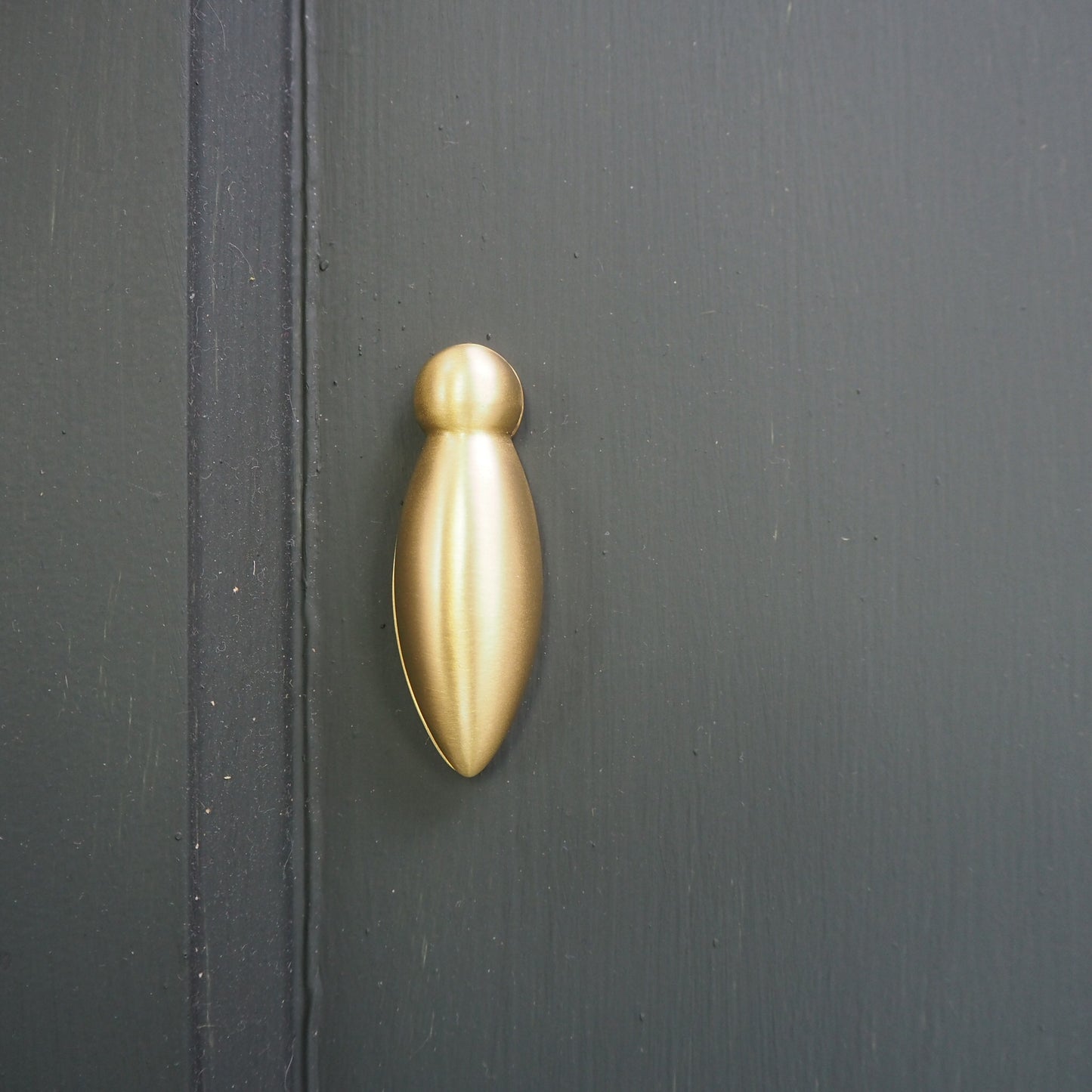 Satin brass tear drop escutcheon