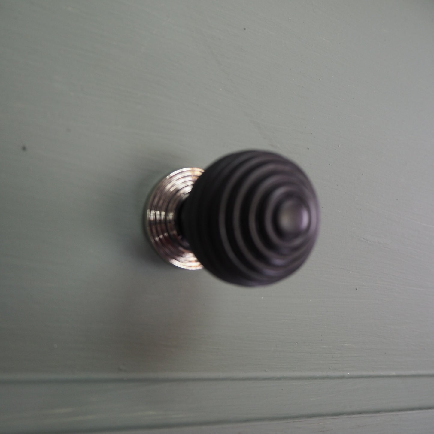 Ebony beehive cupboard knob with polished nickel rose