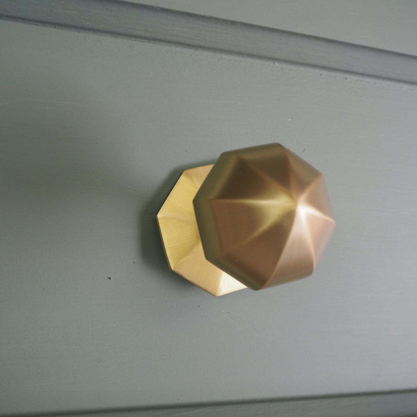 Satin brass faceted centre door knob