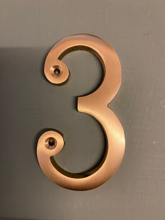 Satin brass numeral “3”