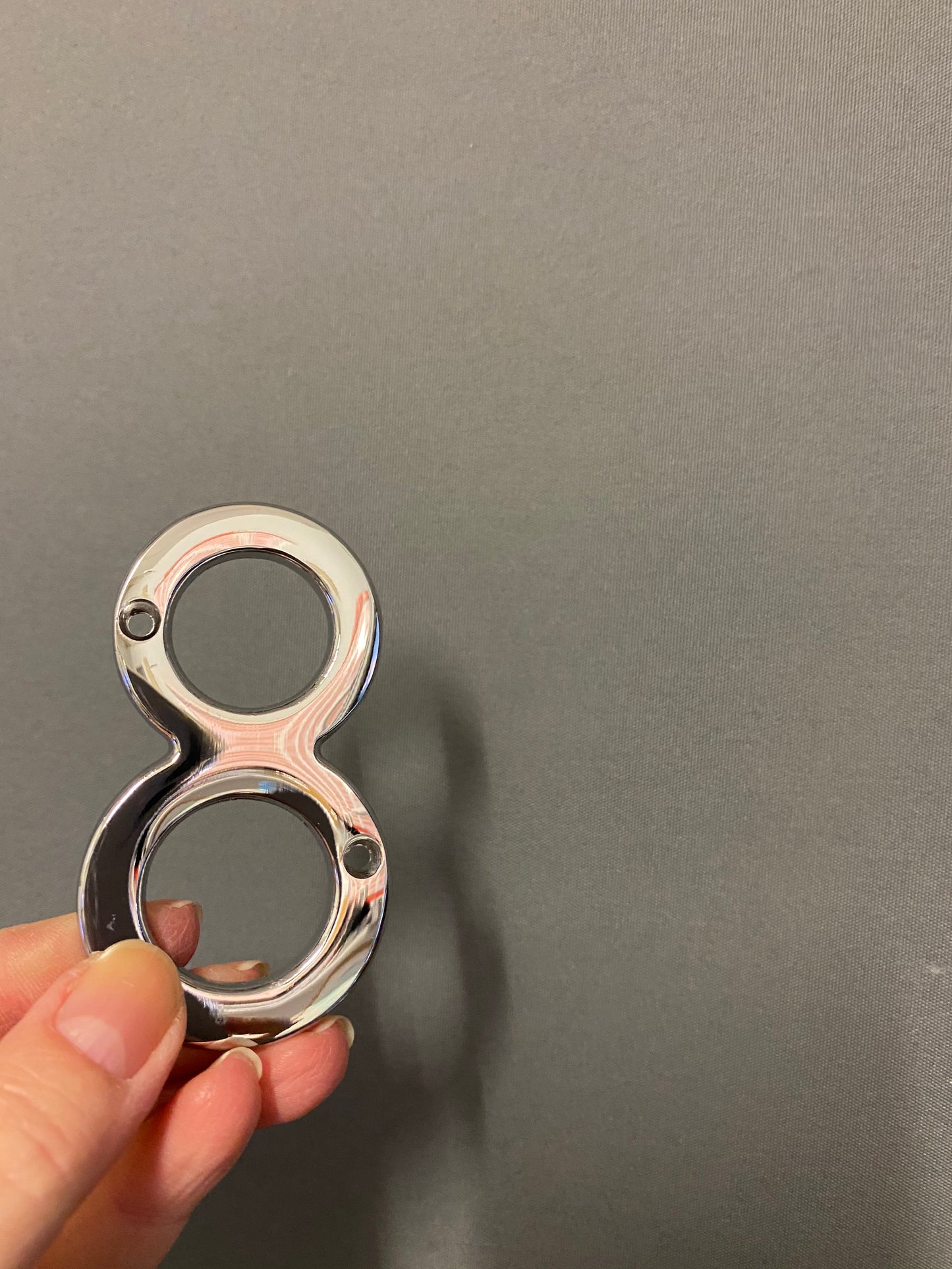 Polished chrome “8”