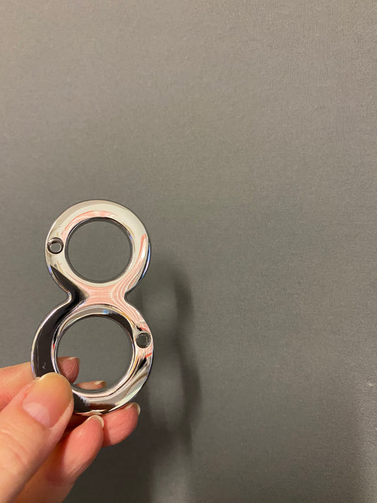 Polished chrome “8”