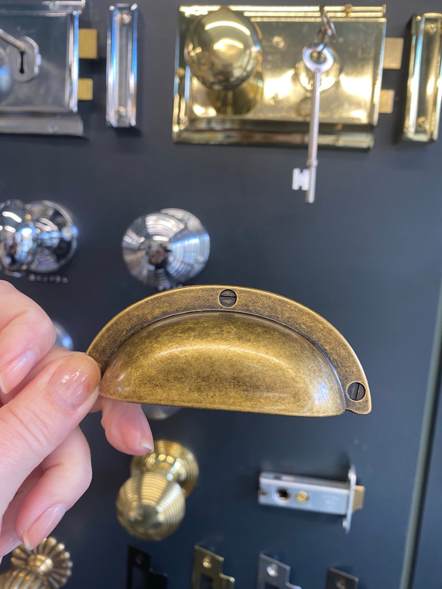 Distressed brass drawer cup pull