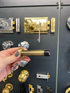 Projection door stop antique brass
